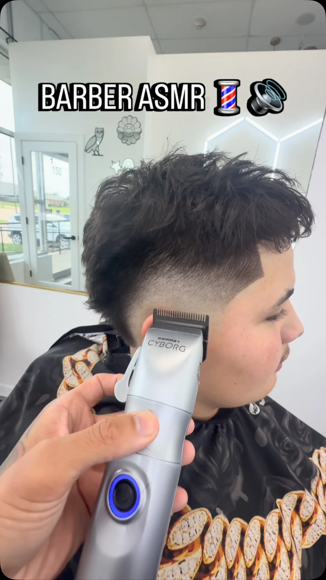Tyler detailing a textured haircut with clippers in The Fade Room studio